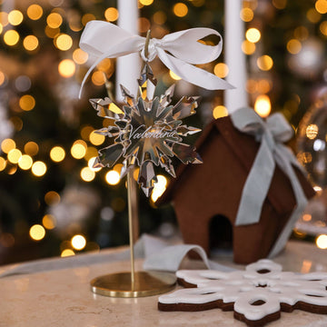 Personalised crystal icicle snowflake ornament on a gold stand with silver ribbon
