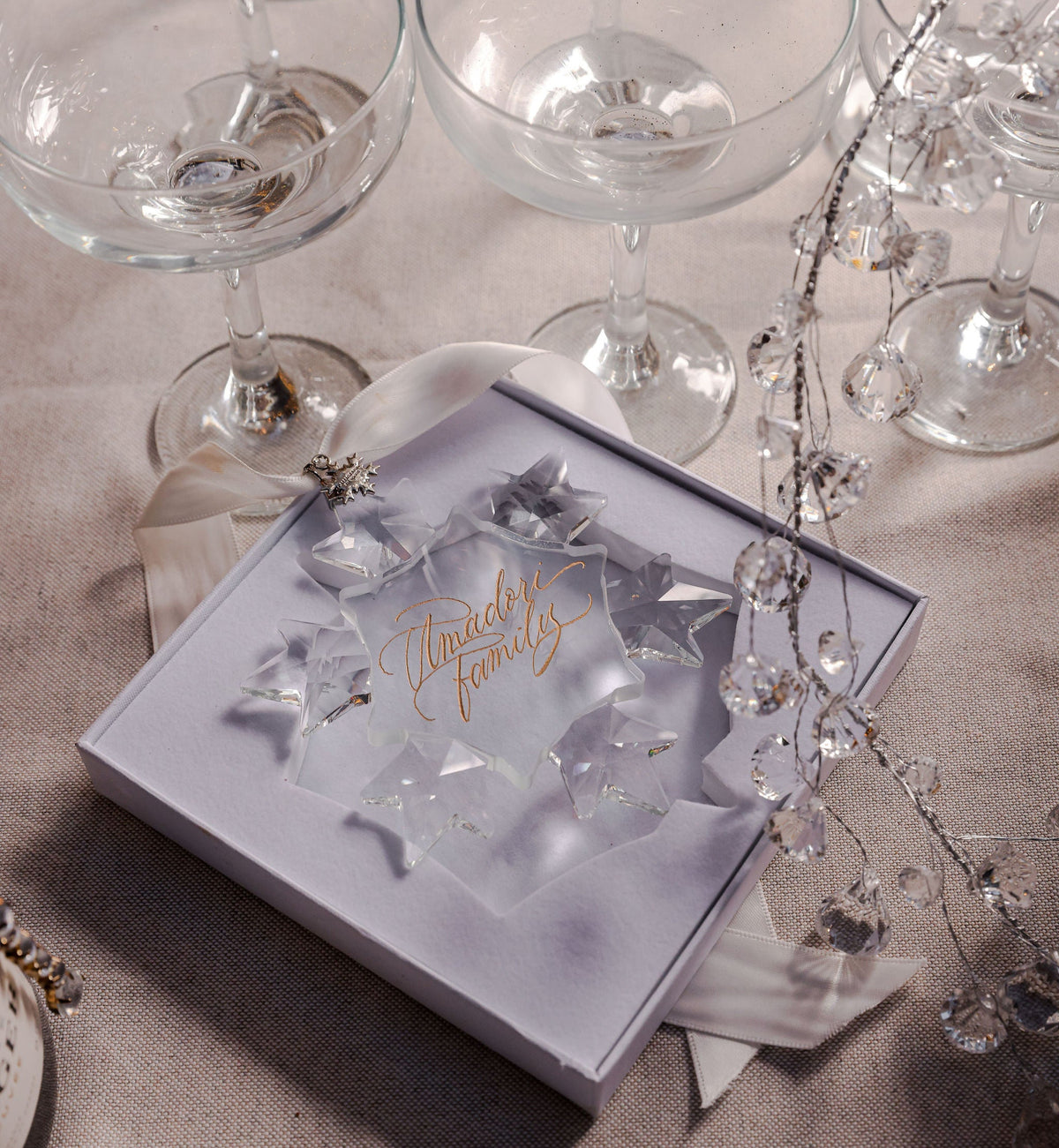 2026 year charm with a crystal snowflake ornament in its gift box