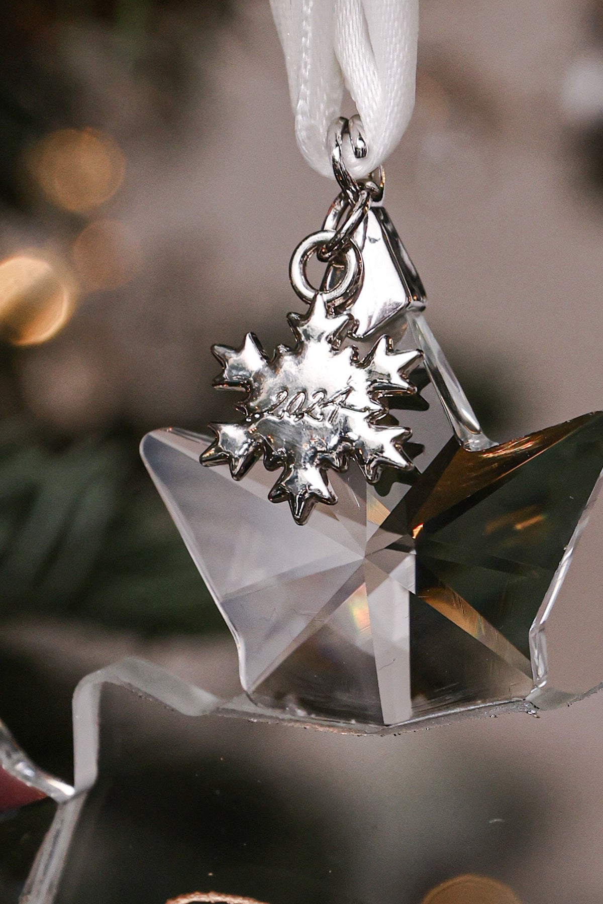 Snowflake year charm on a crystal Christmas ornament