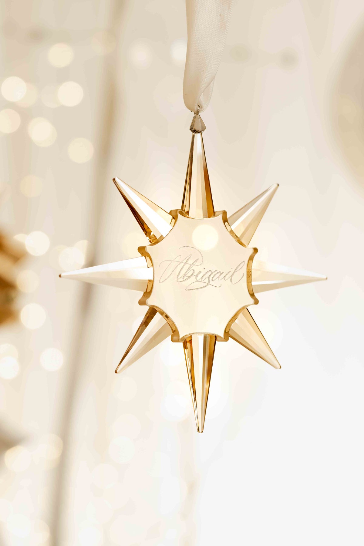 Golden crystal star Christmas ornament hand-engraved in calligraphy