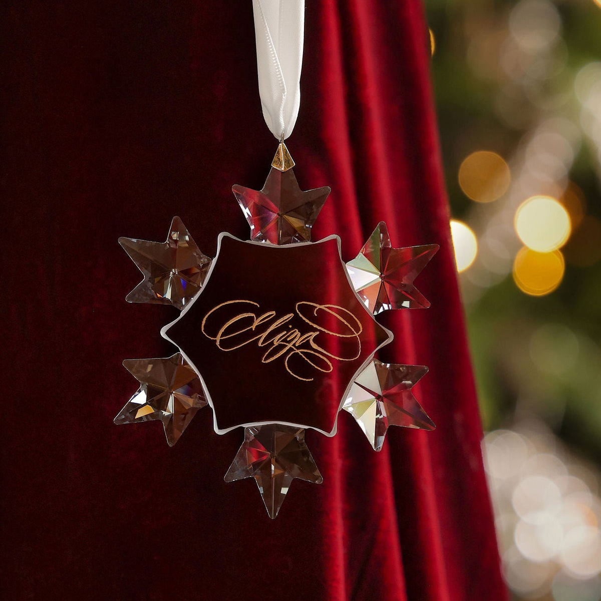 Crystal snowflake ornament engraved in flourished opulent calligraphy