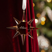 Gold crystal star Christmas ornament engraved with the name Olivia