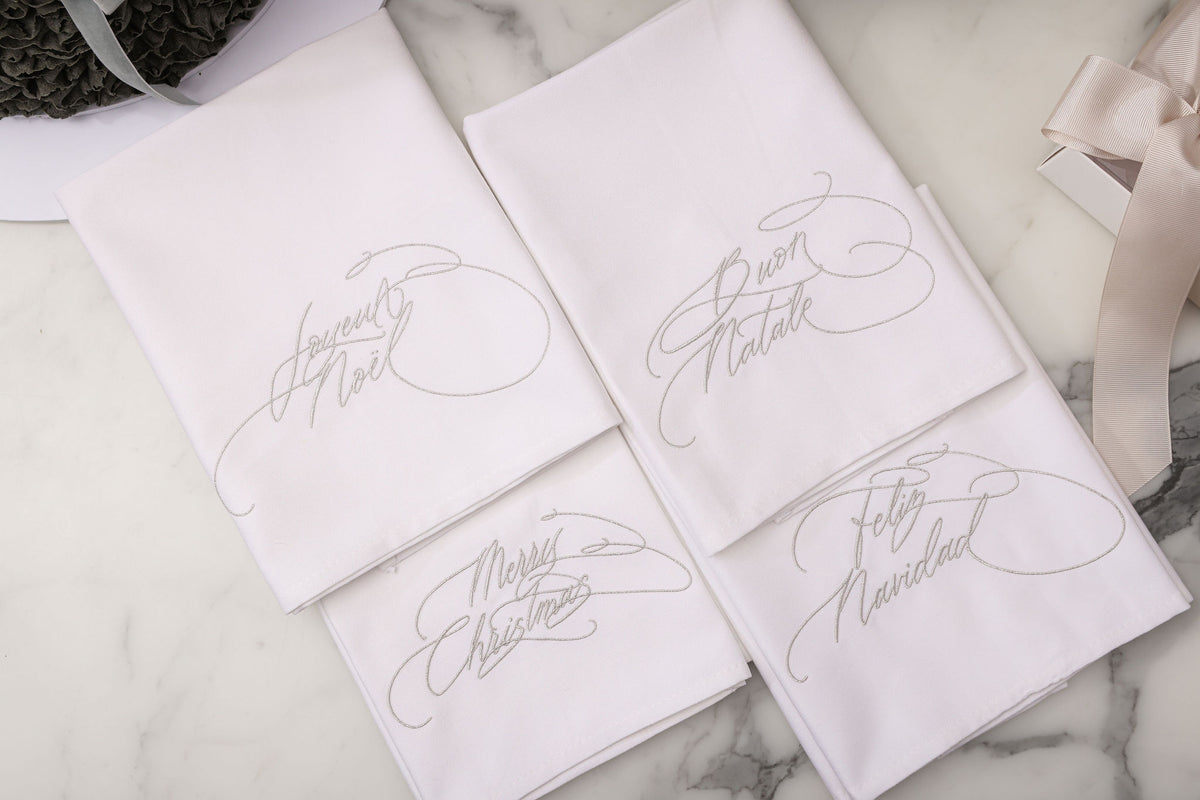 Embroidered Christmas napkins in metallic silver thread