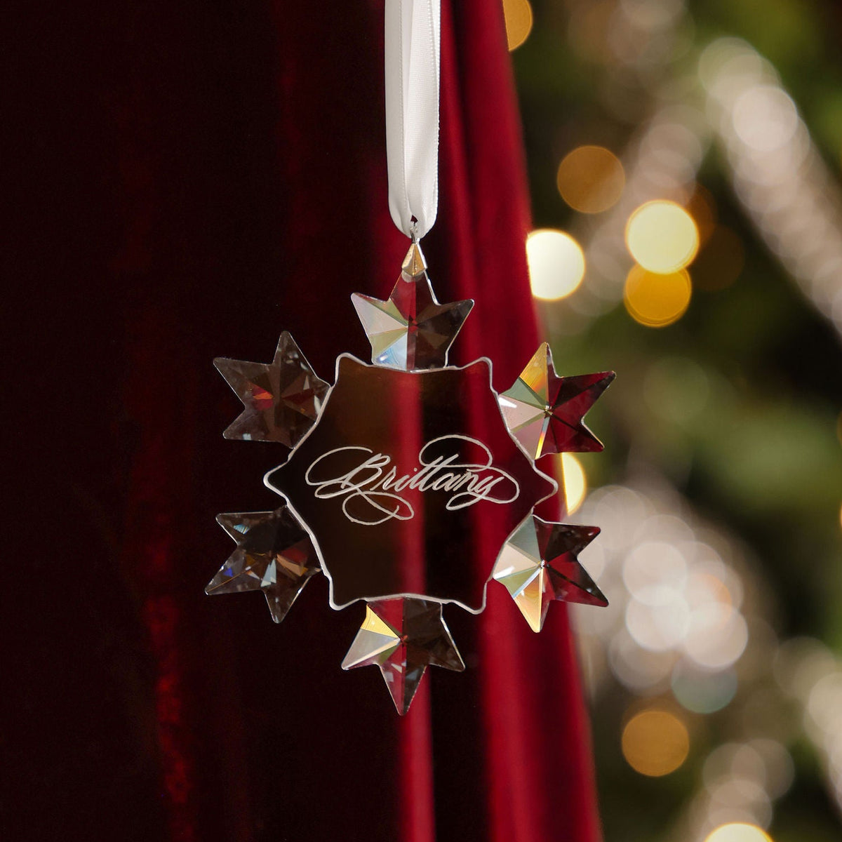 Opulent calligraphy engraved snowflake bauble with the name Brittany